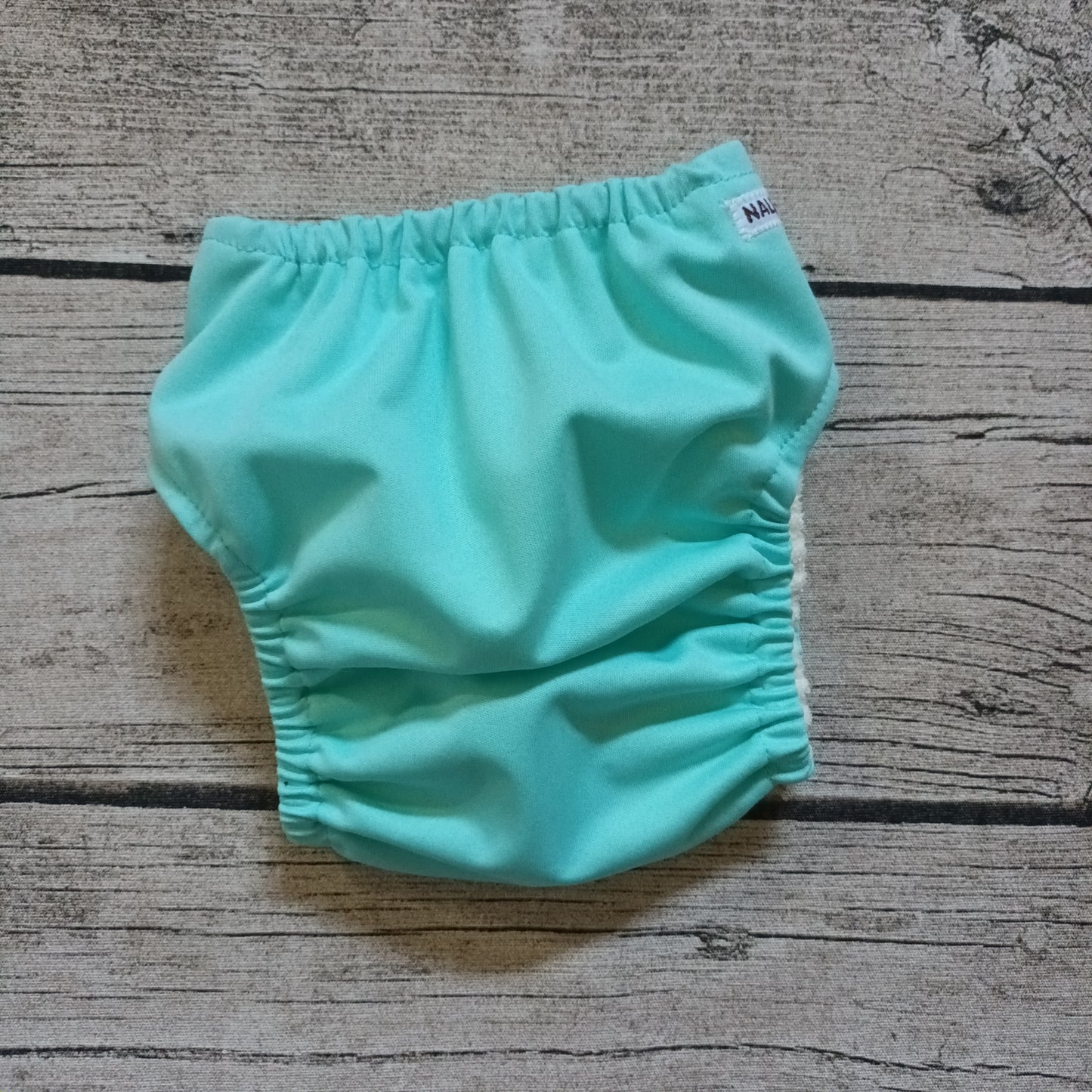 Nalle: Tasku-Nalle - Vaalea turkoosi TILAUSTUOTE