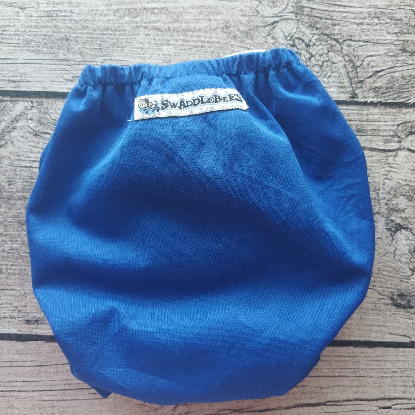 Kirppis: Swaddlebees - taskuvaippa (L)