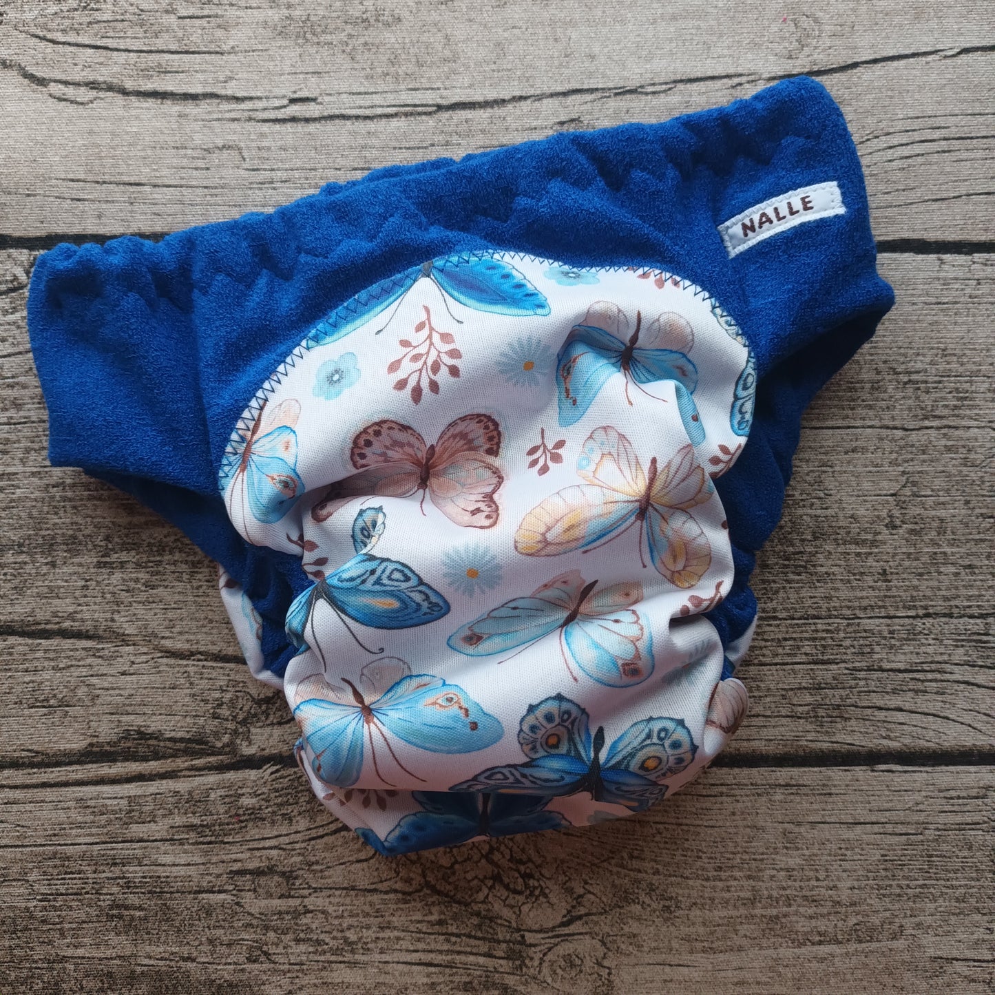 Nalle: Hiekkapikkarit (80) - Perhoset, sininen